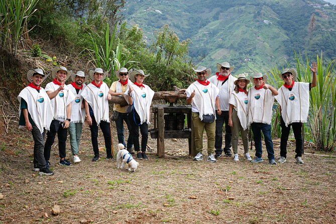 Coffee Tour with arrival on horseback and sugar cane processing - Putting on the poncho and picking ripe coffee berries