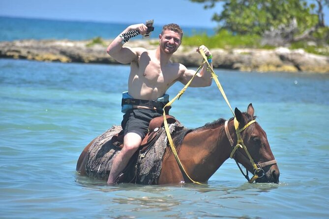 Full Day Private ATV with Zipline and Horseback Riding in Negril - Ziplining above the Caribbean water