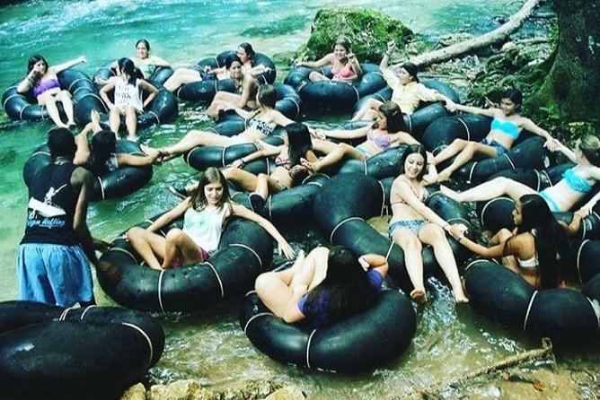 Horseback Ride, Blue Hole, Secret Falls, River Rafting & Tubing - White River tubing through the rainforest