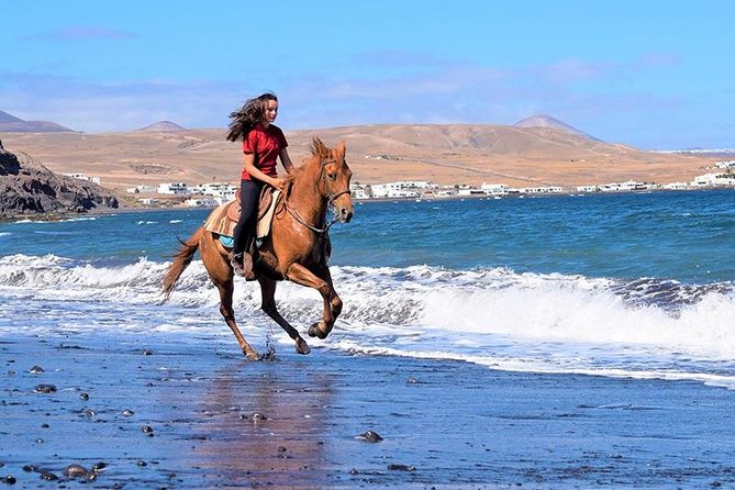 Horseback Riding in the sunset of Famara Beach, Lanzarote, Spain - A ride for regular riders, not just photo seekers