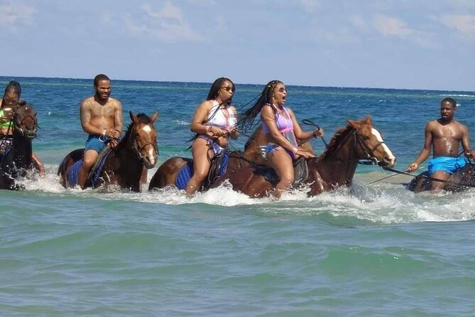 Private Bamboo Rafting and Horseback Riding from Ocho Rios - Riding horses along the beach and into the ocean