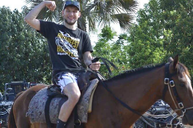 Punta Cana Horseback Riding Adventure with Exclusive Visits - Cooling off at the river