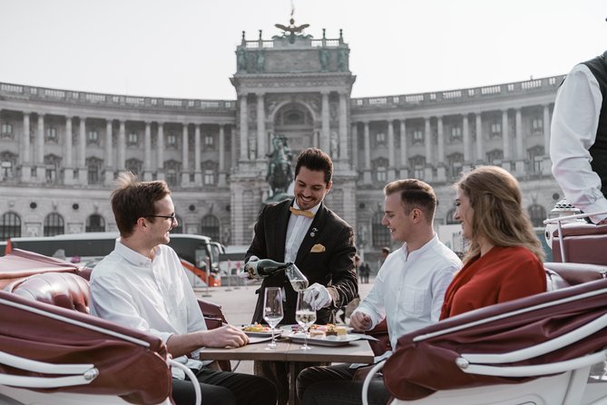 Vienna Horse-Drawn Carriage Ride with Sparkling Wine and Food - Starting beneath the Hofburg