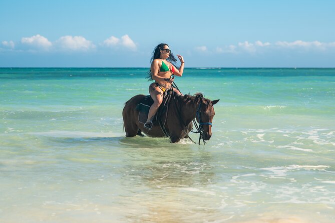 Zipline, Dunn’s River Falls, Bamboo Rafting & Horseback Ride Tour - Horseback riding and swimming at St. Ann’s Bay